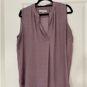 L oft purple and white patterned sleeveless blouse. Fits like an XL